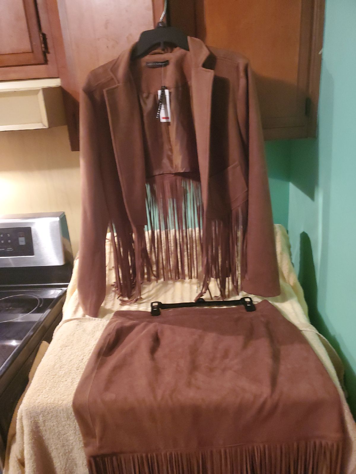 Light brown suede suit with fringes