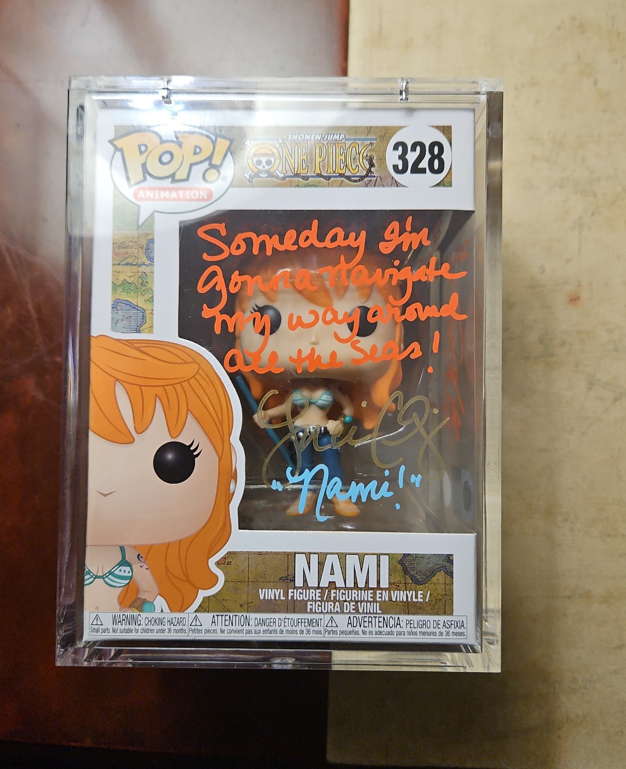 Dual signed nami funko by Japanese and English voice actors