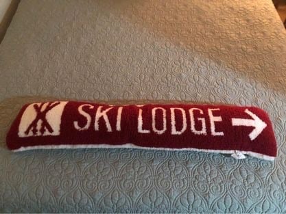 Decorative hooked wool bolster ski pillow