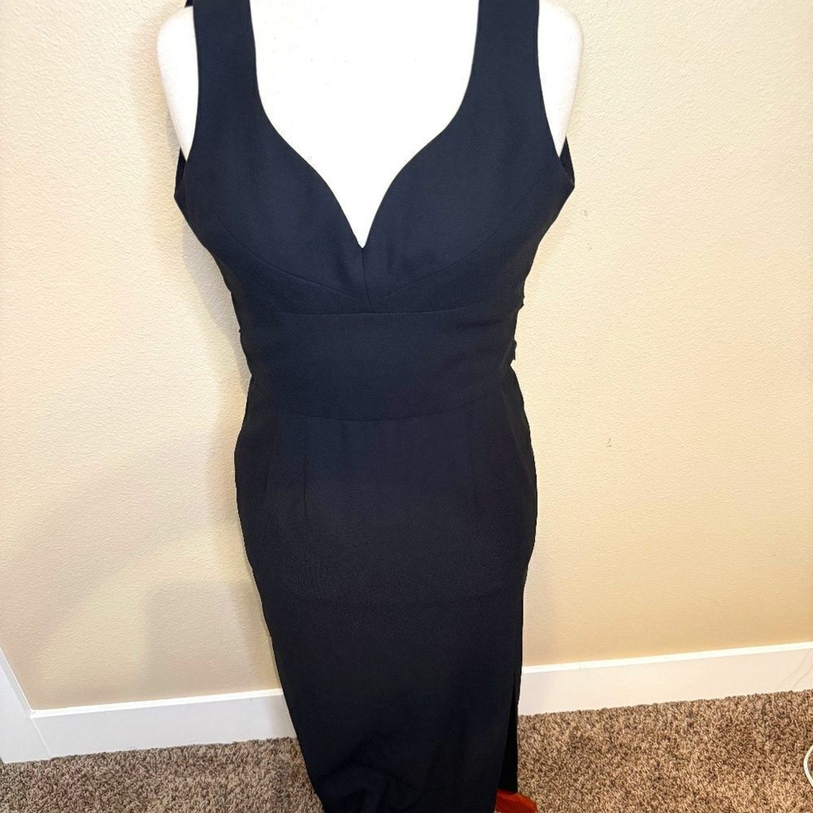 Gillian black formal long dress with deep open neckline, drama bow at the back
