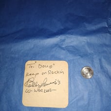 Autographed coaster by Bobby Lewis