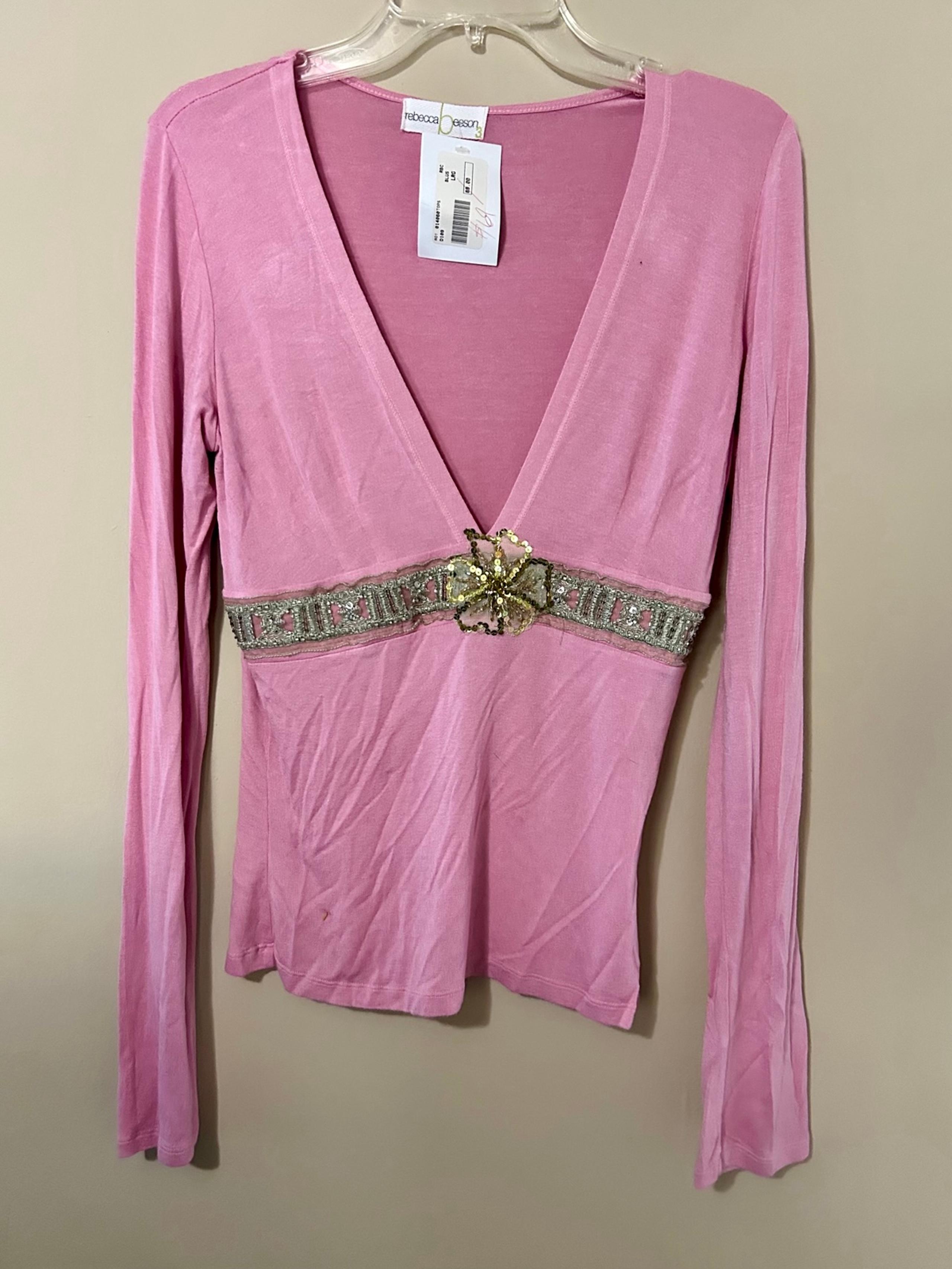 Pink long sleeved top with metallic accents