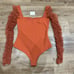 Free People Must Be Love Long sleeve Bodysuit Deep Orange Size Small NEW