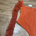 Free People Must Be Love Long sleeve Bodysuit Deep Orange Size Small NEW