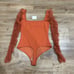 Free People Must Be Love Long sleeve Bodysuit Deep Orange Size Small NEW