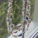 Aurora Borealis 3 Strand Vintage 16 Necklace with Gold toned Flower spacers