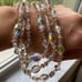 Aurora Borealis 3 Strand Vintage 16 Necklace with Gold toned Flower spacers