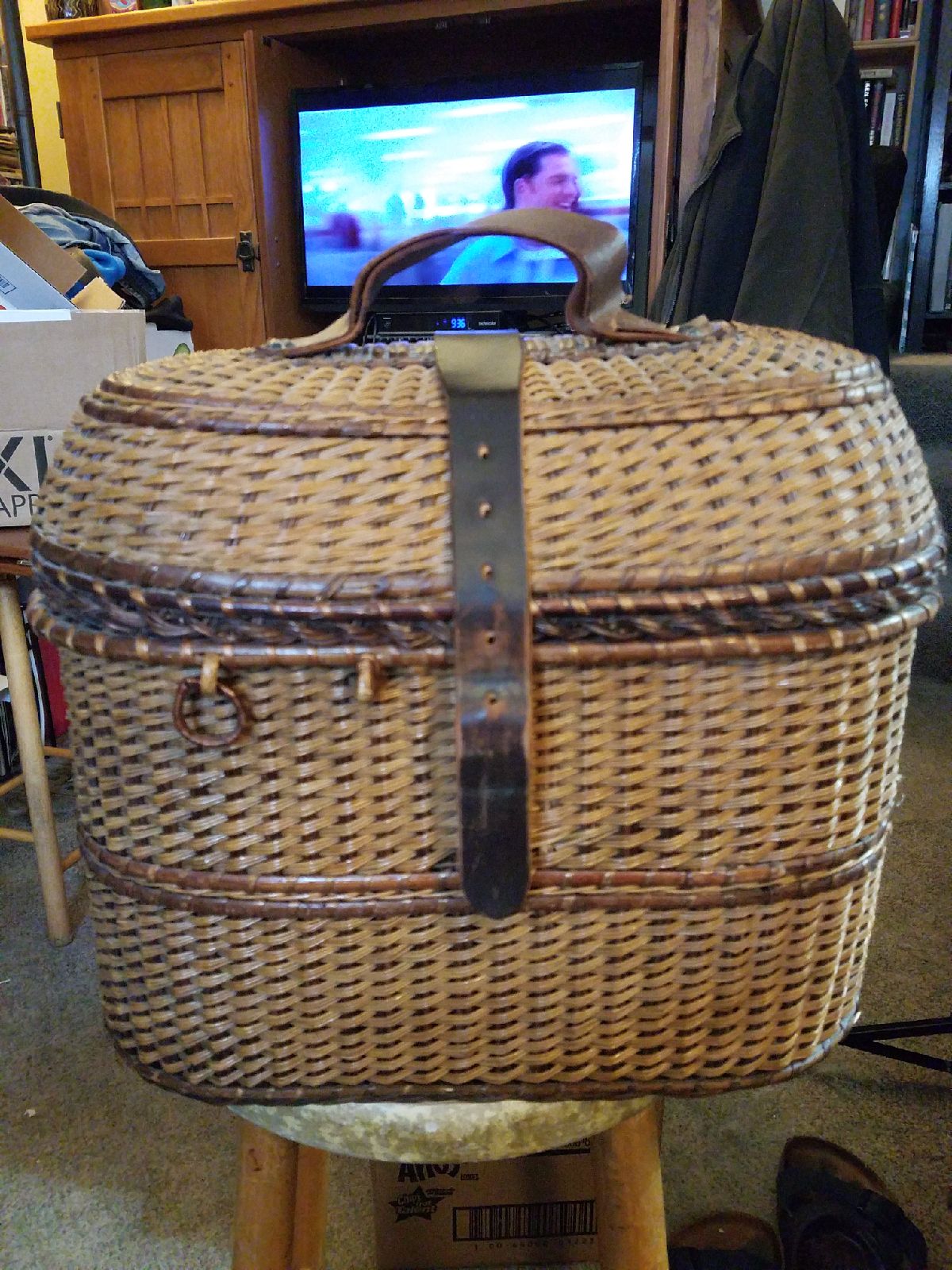 Basket rattan with red leather inside.