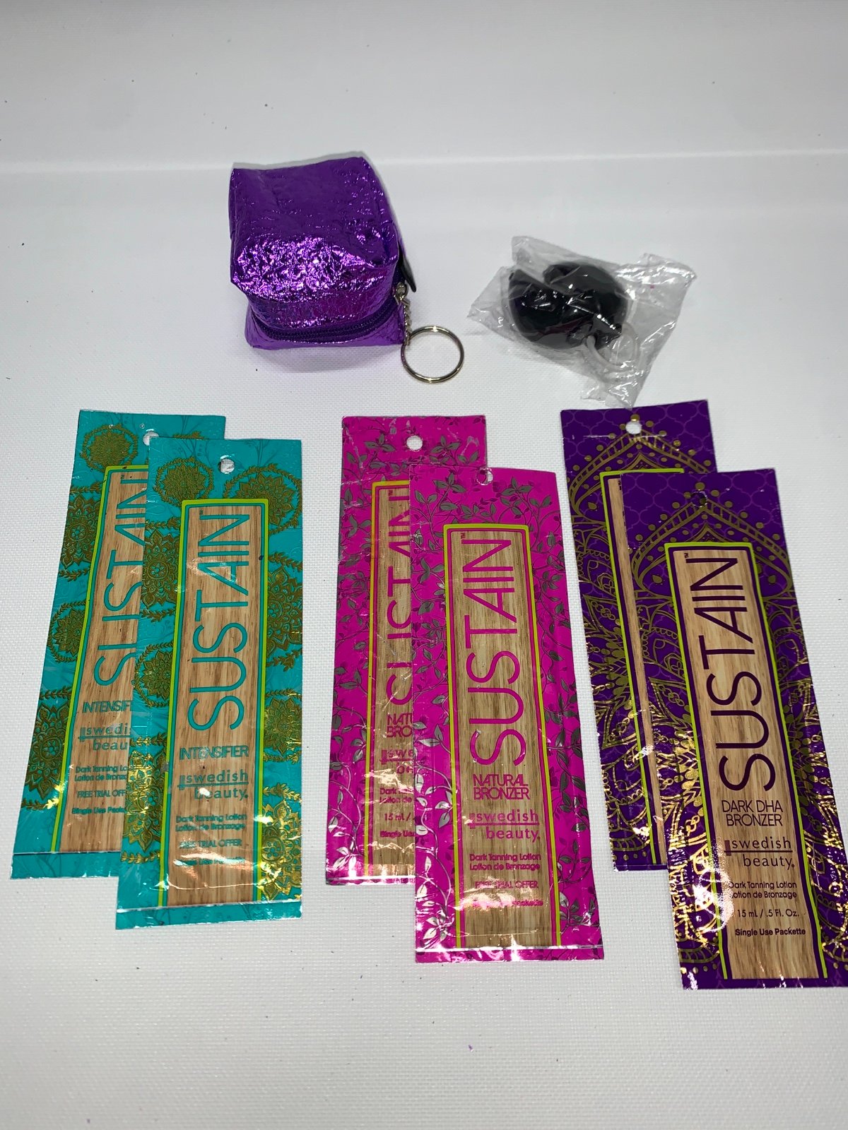 Swedish Beauty Sustain Natural tanning lotion packets Designer Gold goggles