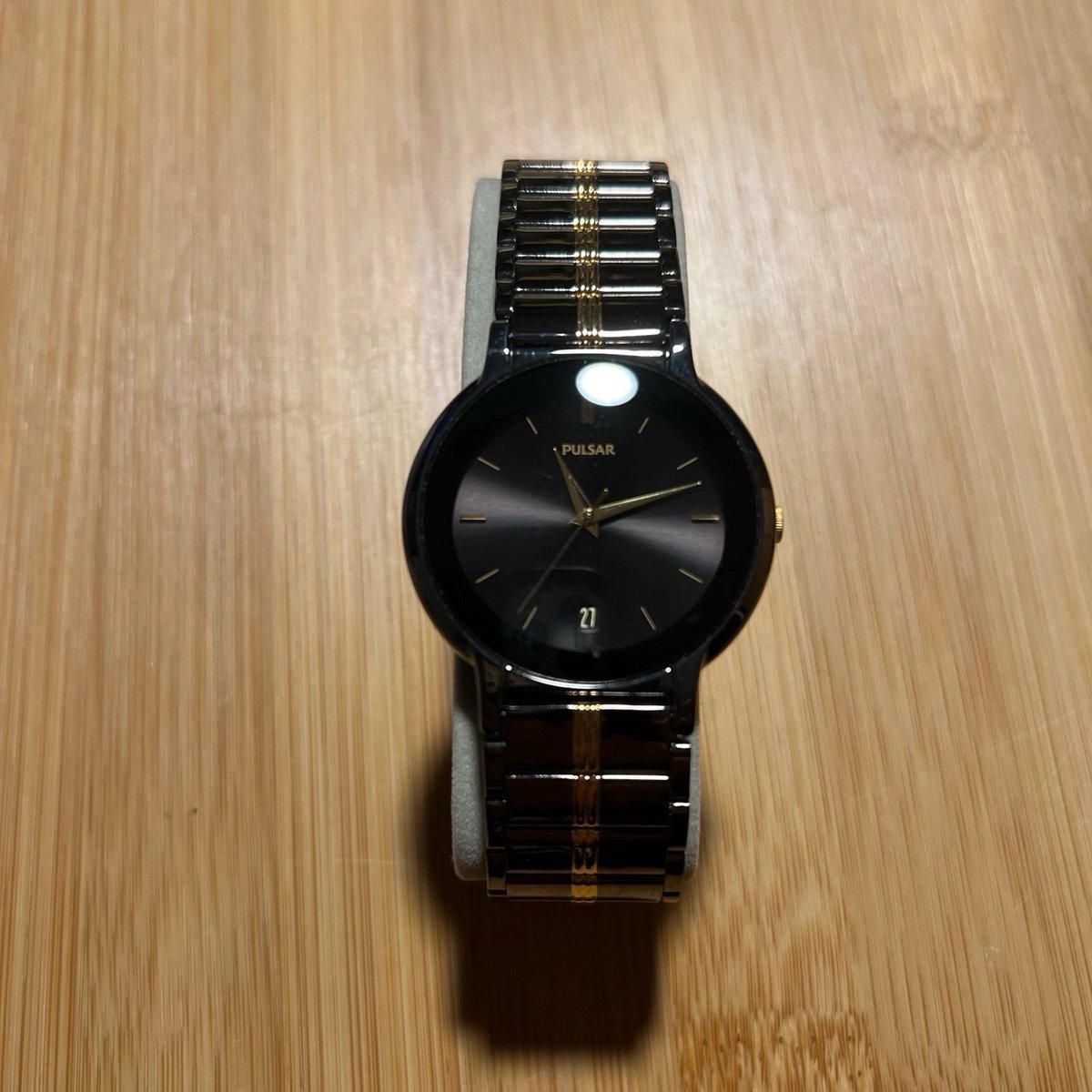 Men’s black and gold tone pulsar watch