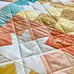 Multi colored squares and stars quilted