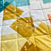Multi colored squares and stars quilted