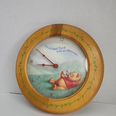 Disney Winnie the Pooh laying down in a Wild Grass Field Wall Clock