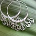 vintage sterling silver Bohemian circle hoop with dangle peace charms earrings