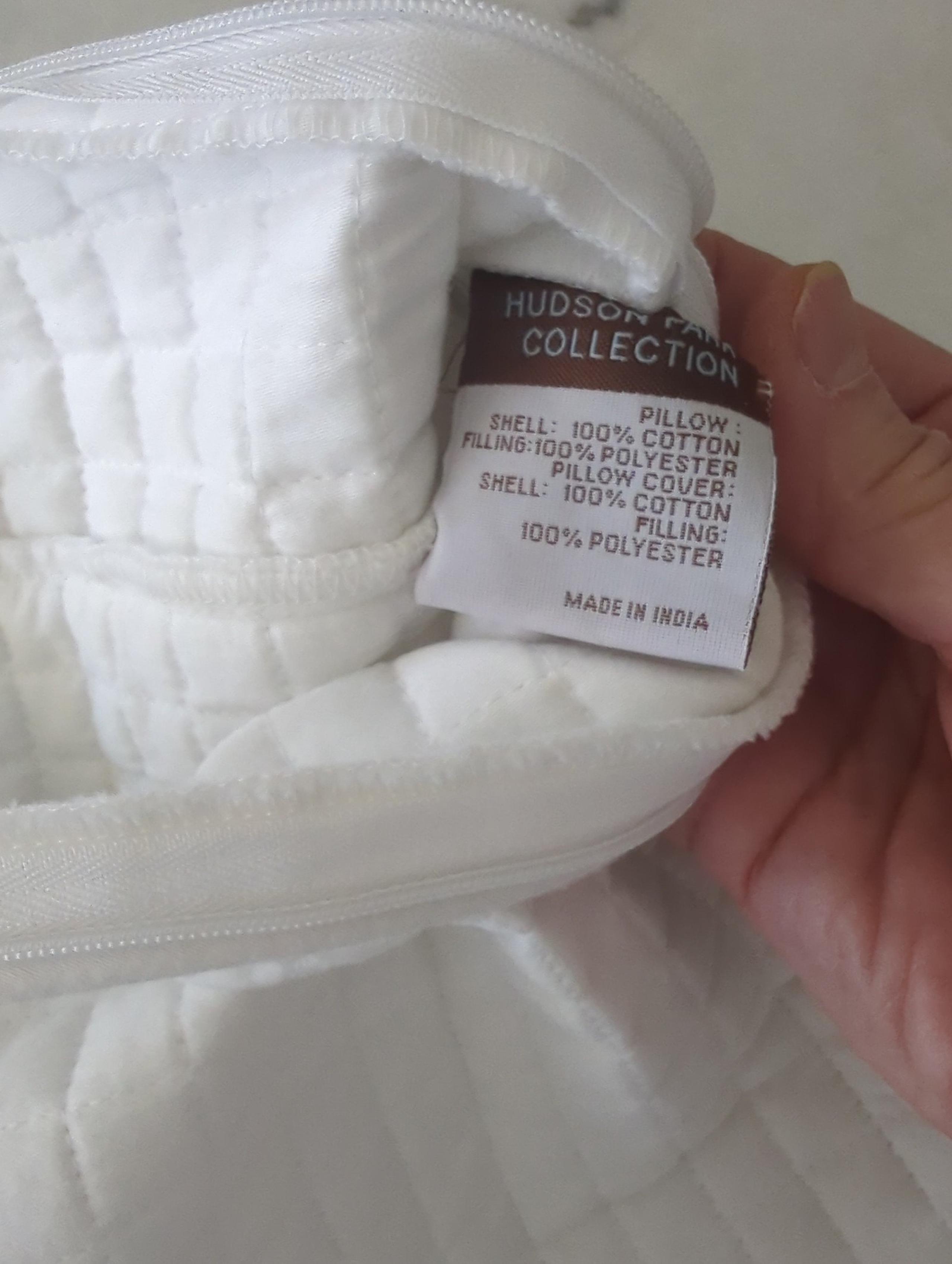 Two white standard Hudson Park mini grid quilted pillow shams plus 12x20 sham