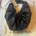 A Bronze Age Satin Croissant Bag