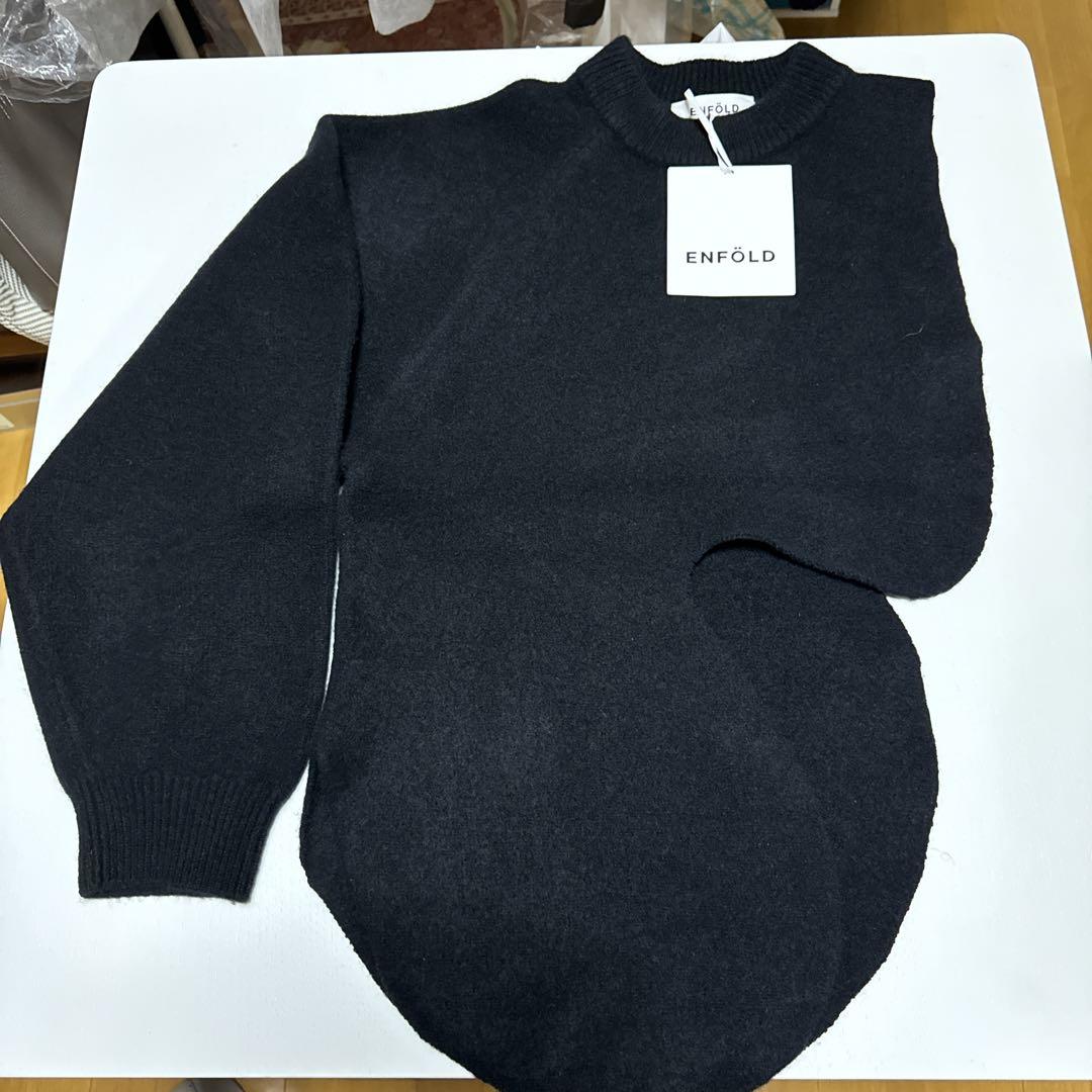 ENFOLD black long-sleeved sweater, size 38, right sleeve only.