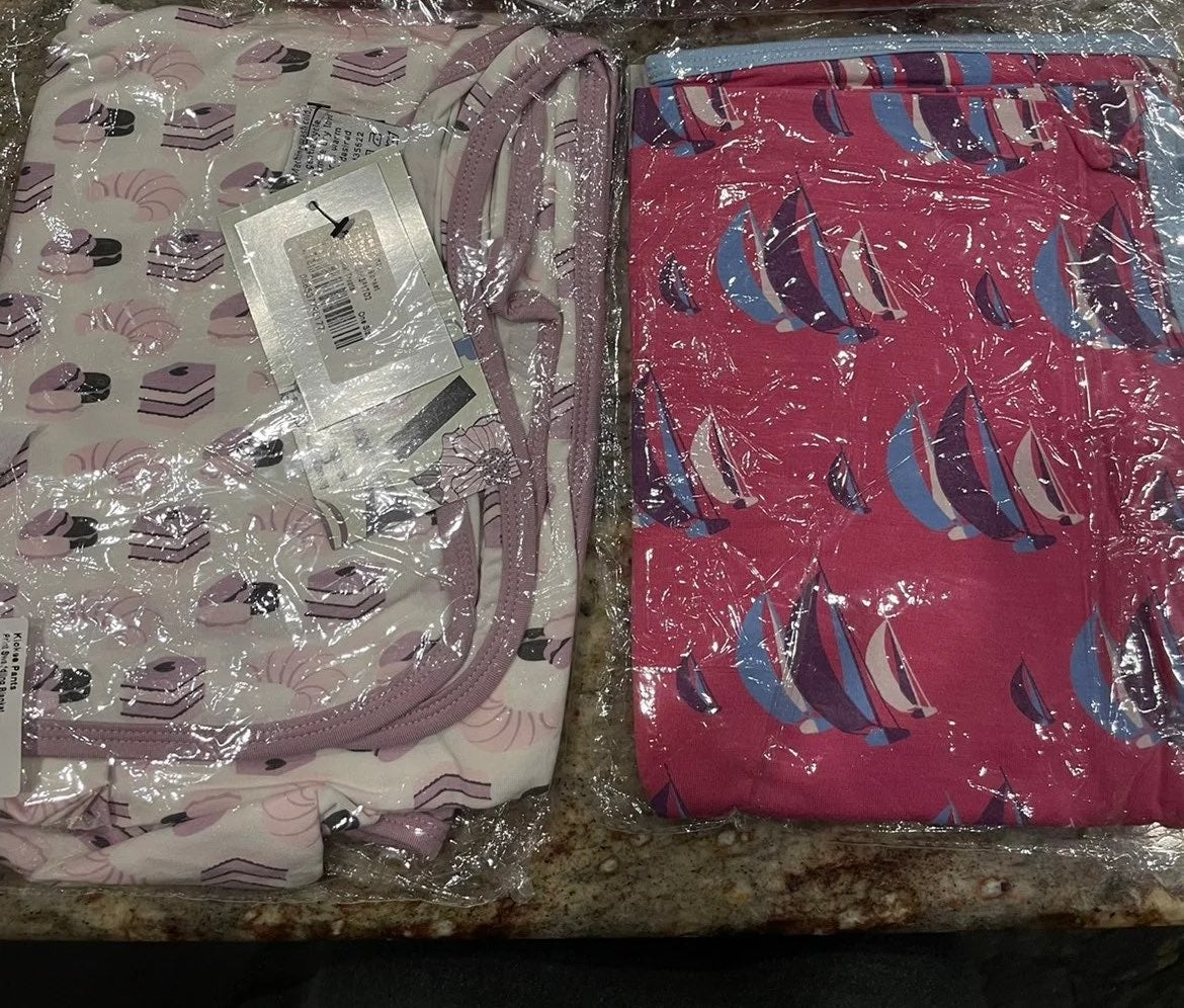 2 new in bag swaddles