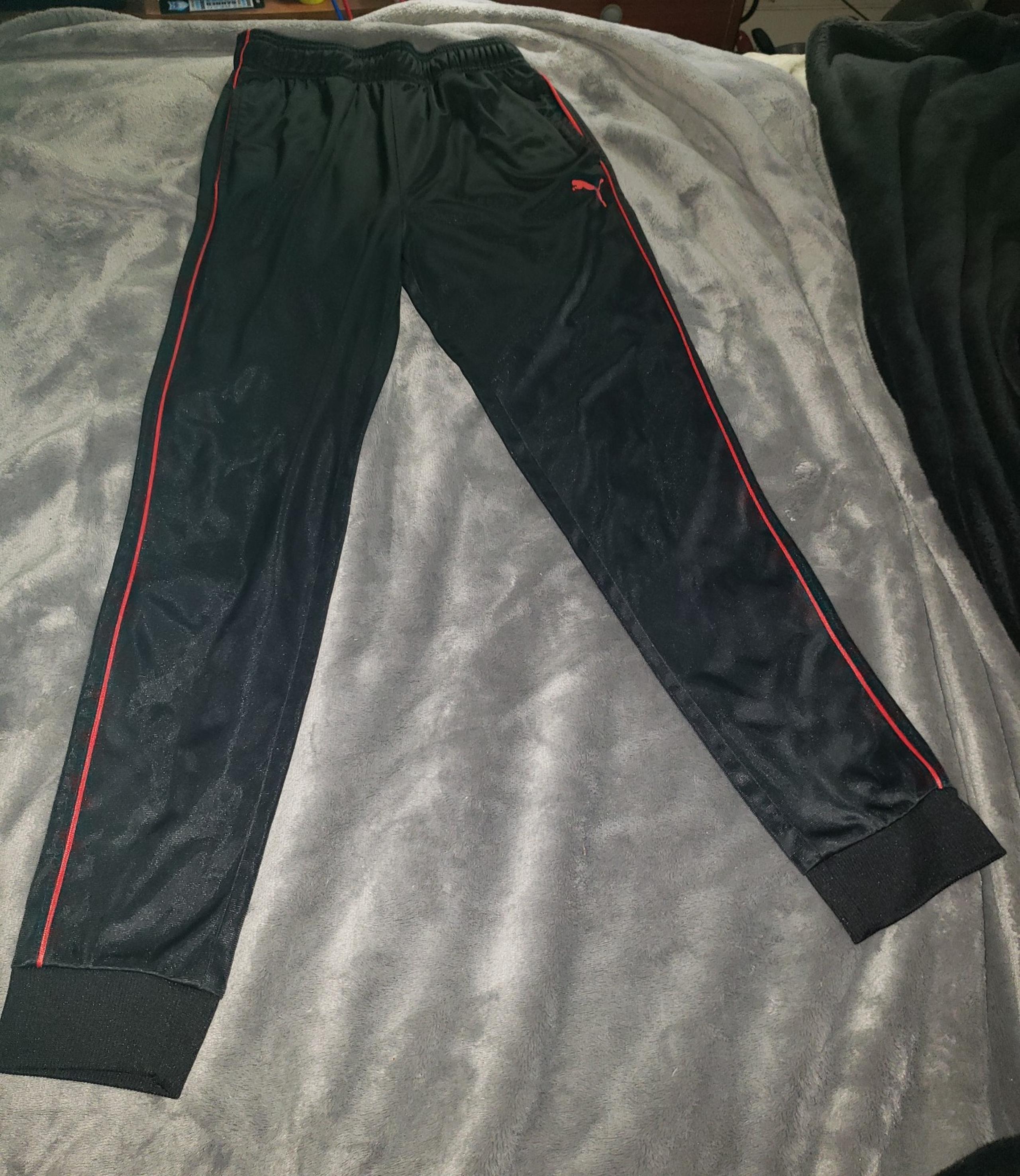 Puma boys athletic pants sz 14/16 black with red stripe on side. Guc