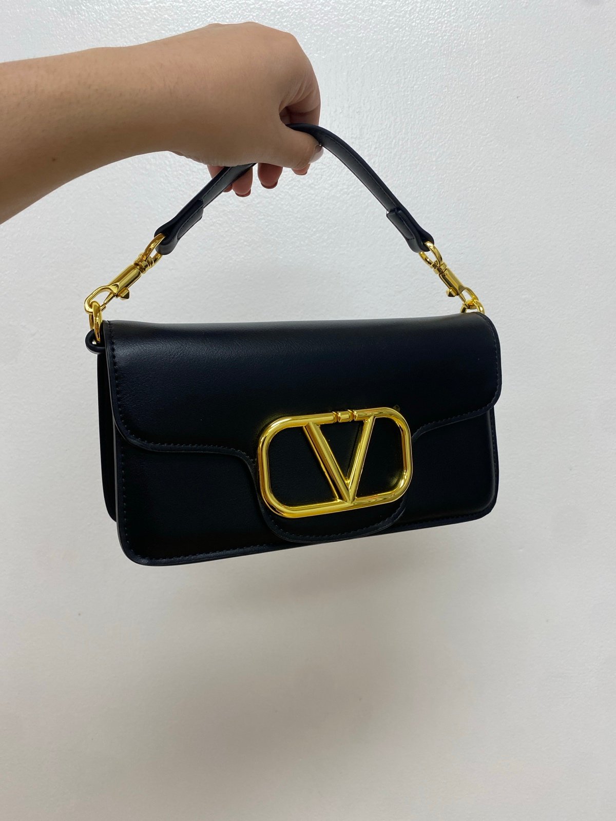 Trendy black and gold handbag
