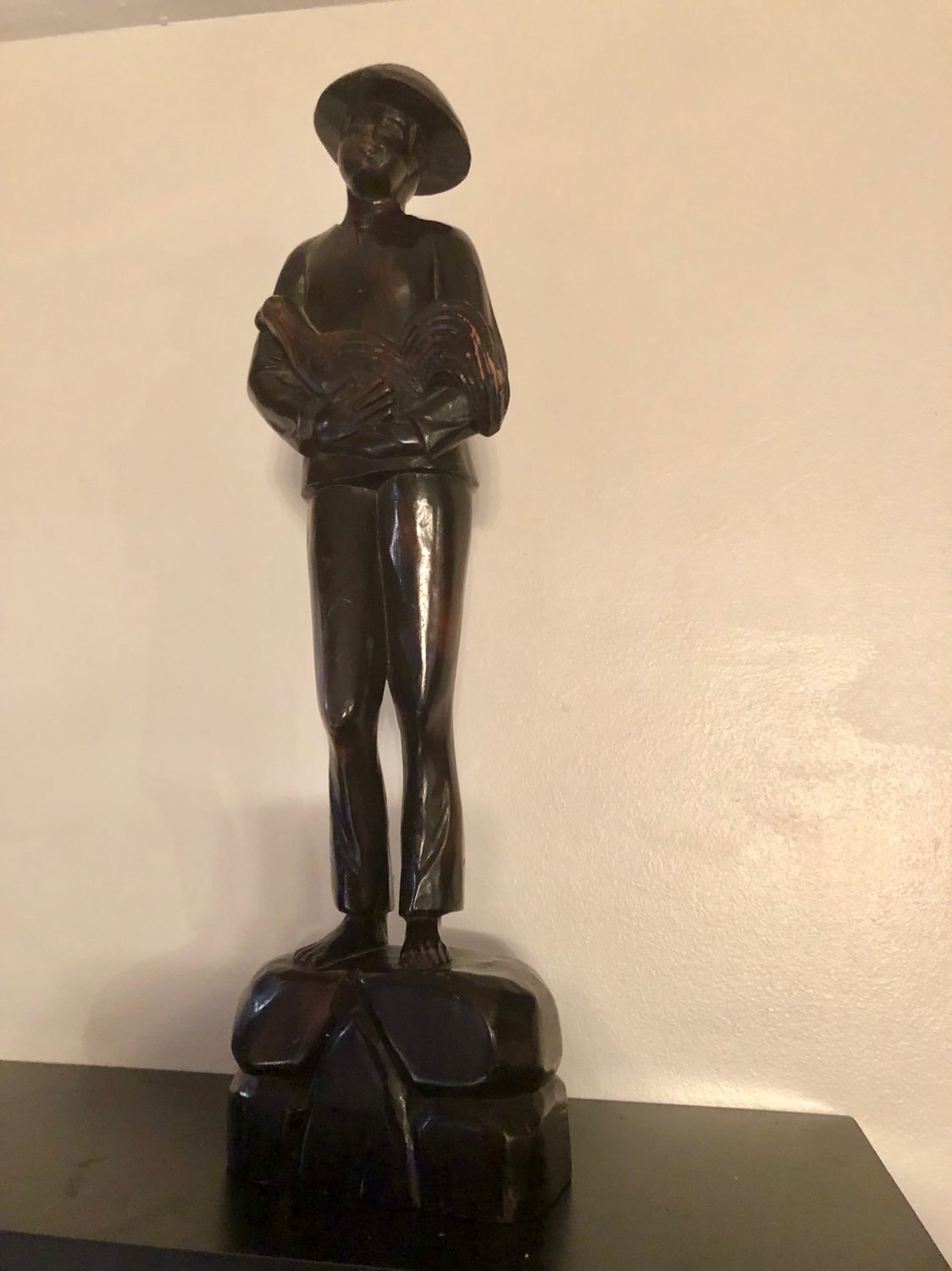 Wood Carving Man Holding a Bird