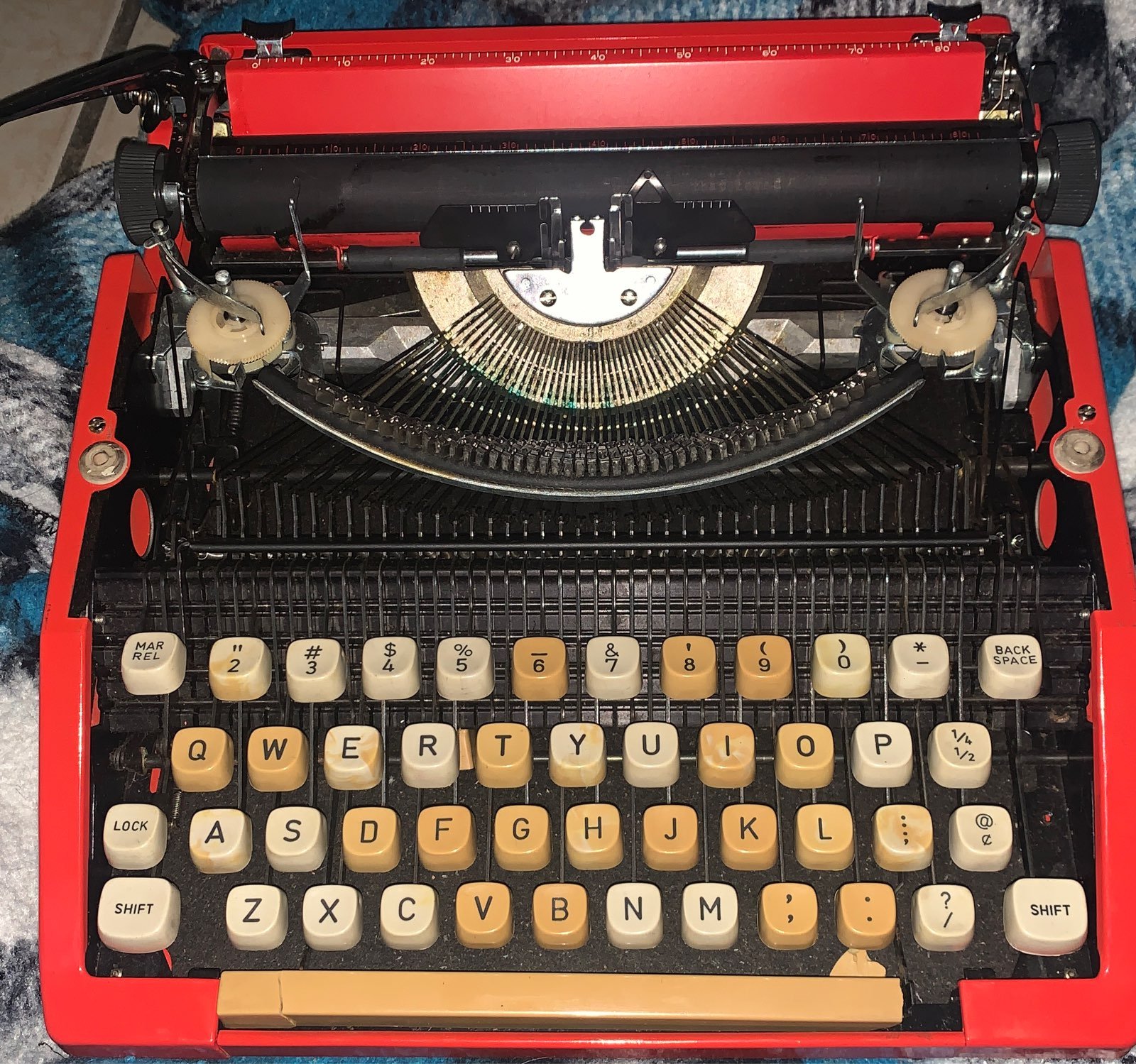 Red vintage type writer with carrying ca