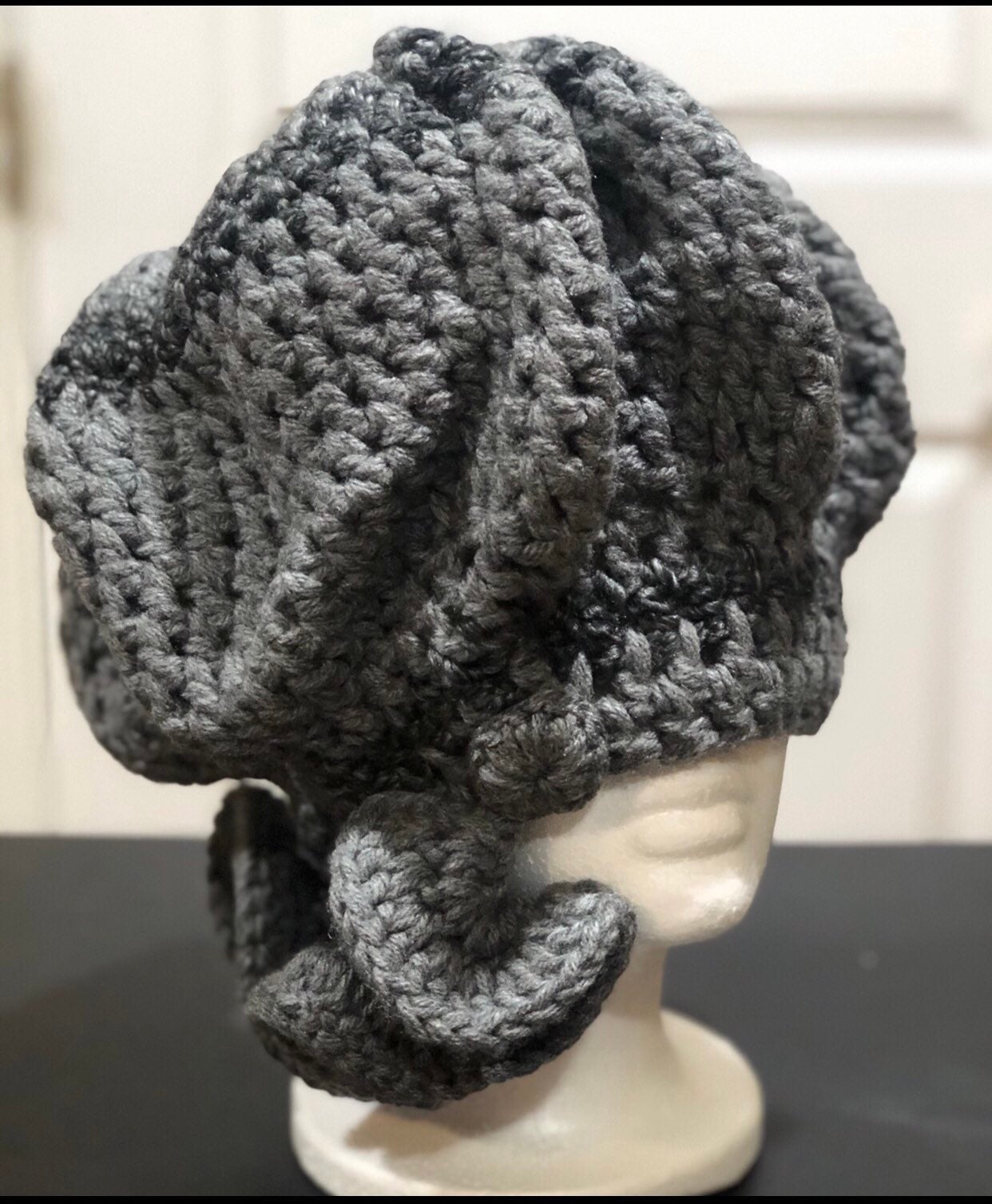 Hand made gray hat, with deep wave on the side.