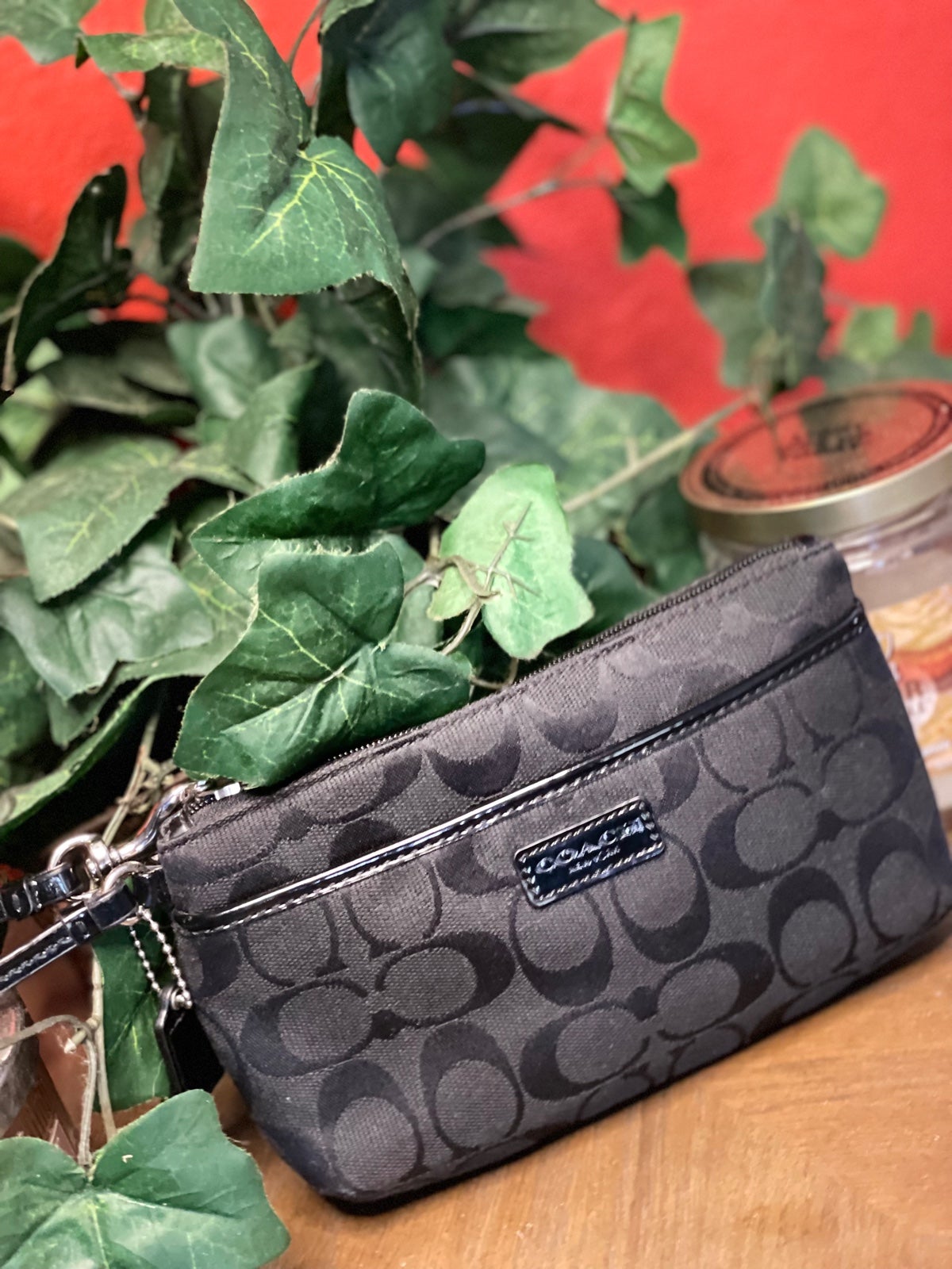 Signature coated canvas with crossgrain leather details