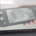 Switch Lite Gray with 2 games, LOTS OF EXTRAS. USED. Adult Owned.