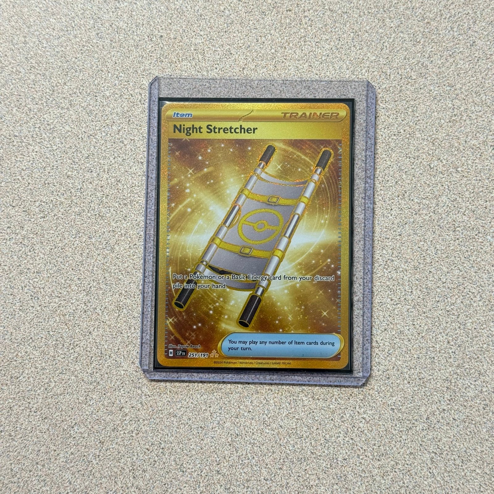 Pokémon Night Stretcher - 251/191 - SV08: Surging Sparks (SV08) Gold Hyper Rare