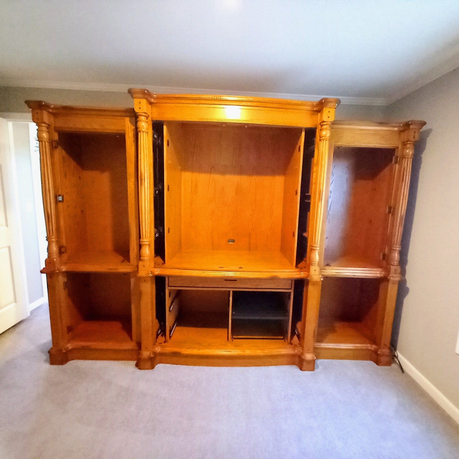 entertainment center The center piece is for sale. 2 end pieces we're sold separ