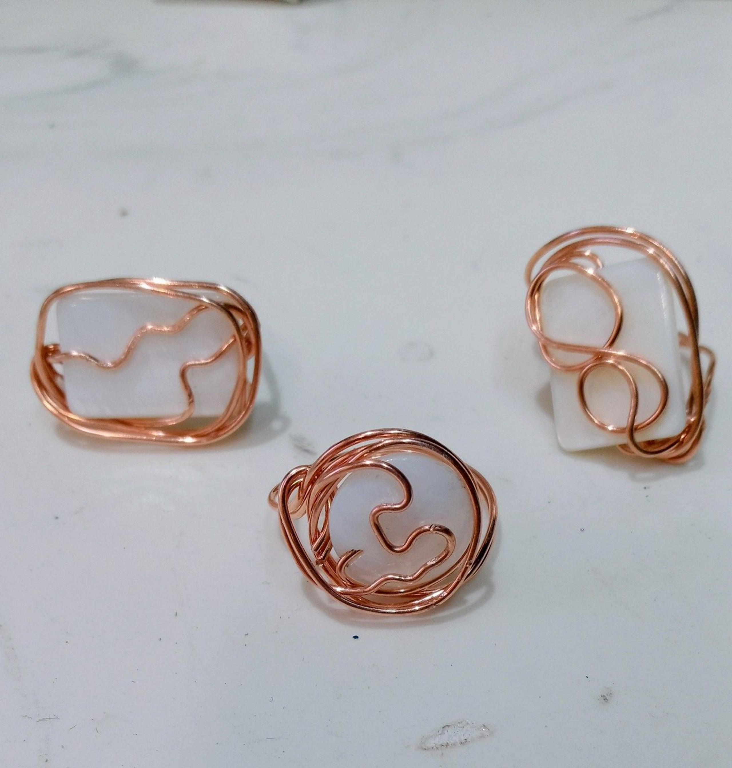 3 copper and mother of pearl rings
