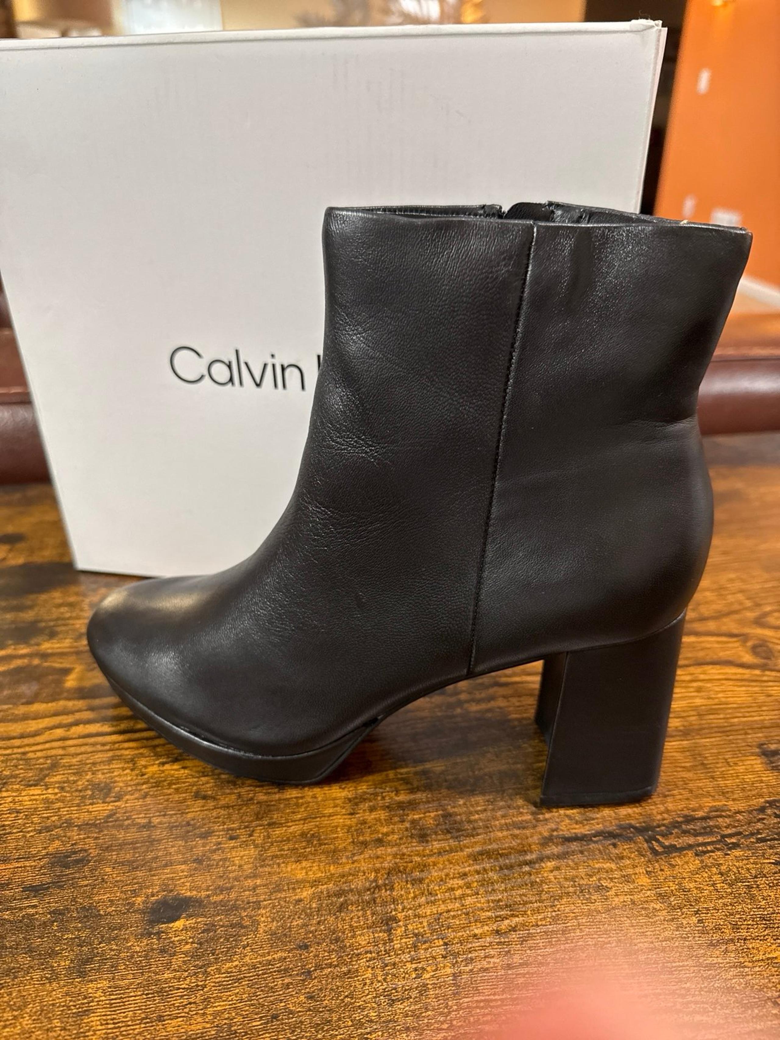 Calvin Klein boot description: 	•	Almond Toe 	•	Zip Closure 	•	Imported 	•	2.95"