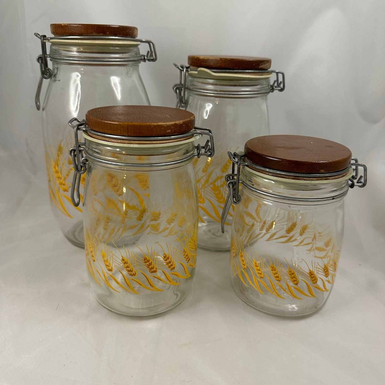 Vintage Set of 4 Wheat, Glass Canisters with Wood Tops, Wire Clamp, Rubber Seal
