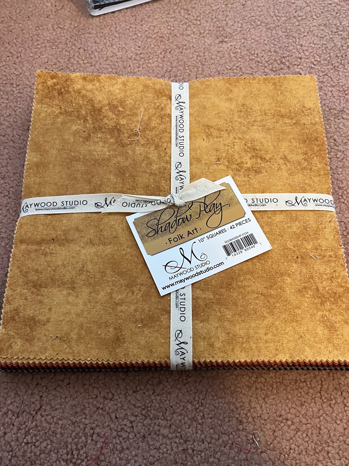 42 ten inch squares of fabric