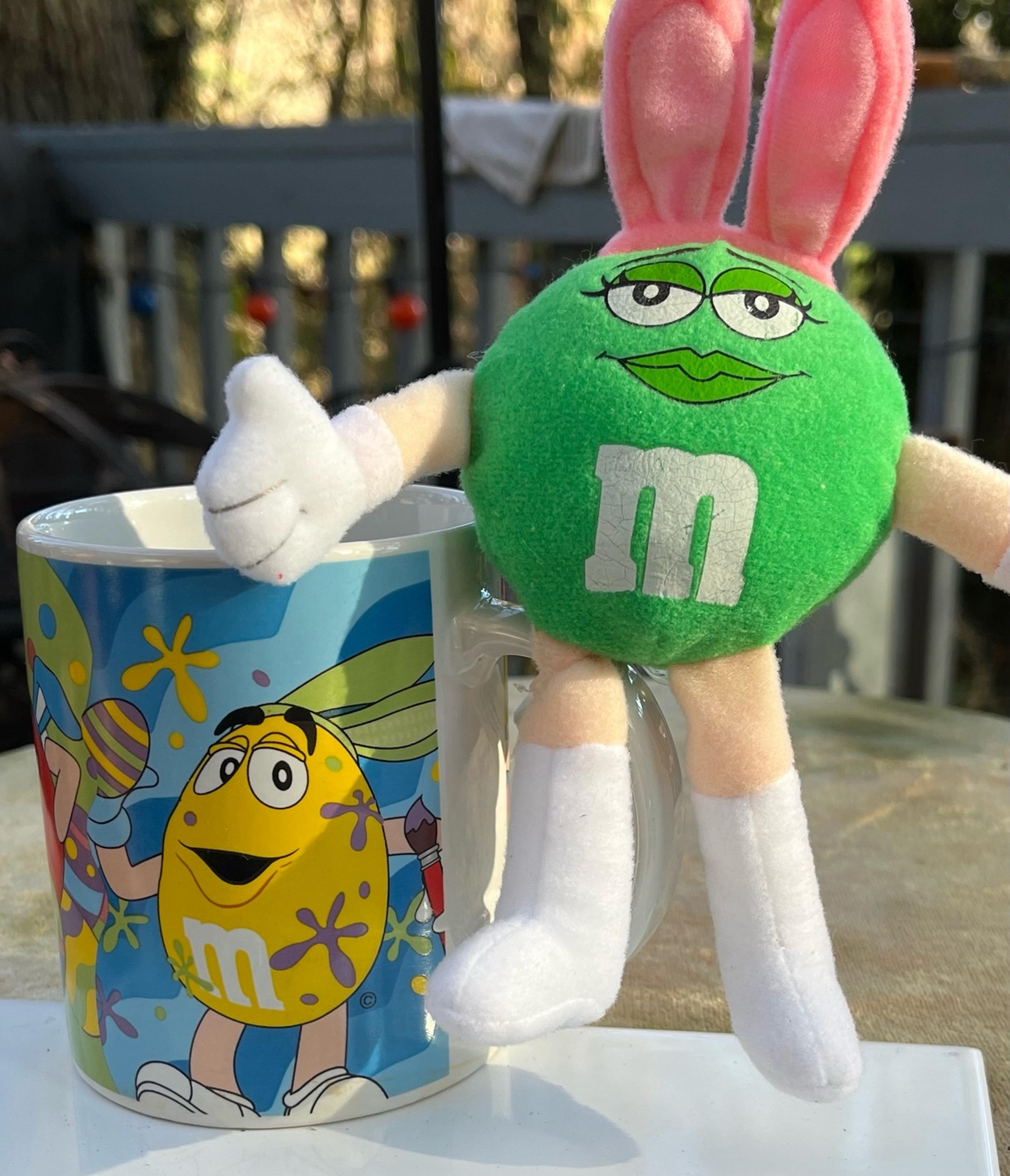 White coffe mug with green M&M mug with m&m party celebration holiday