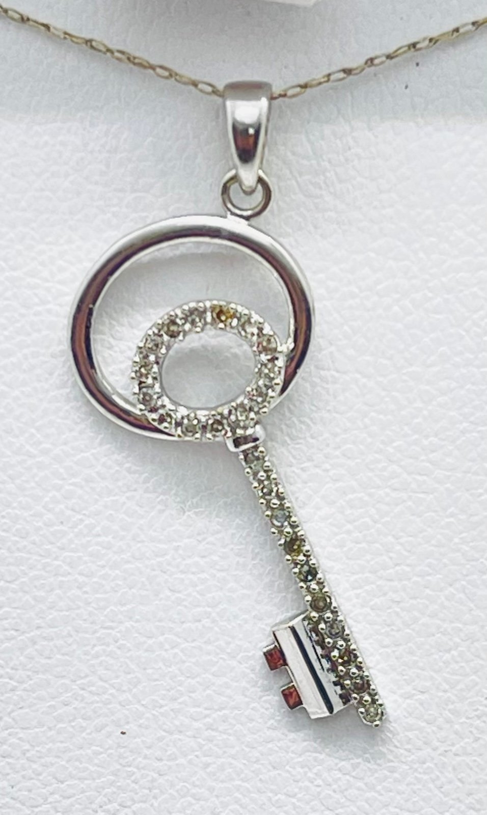 14 K white gold diamond key necklace 18” 1/4 carat 1.60 grams of gold