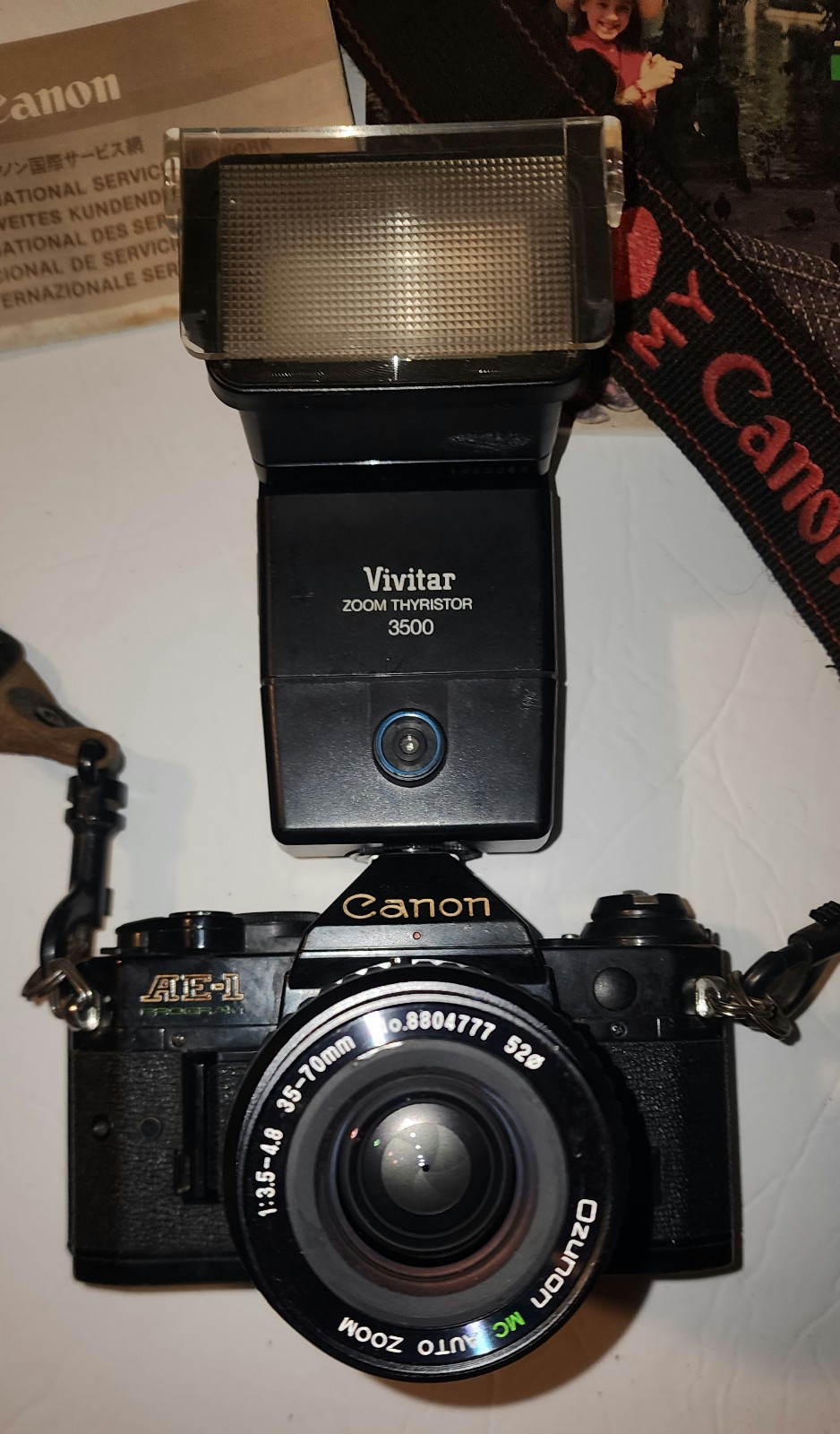 Canon AE-1 with bag, 2 lenses, 2 ultraviolet filters & flash attchment& battery