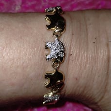 Beautiful vintage gold and rhinestone trucks up lucky elephant bracelet