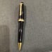 Japanese-made black ballpoint pen with gold accents, Sailor.