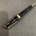 Japanese-made black ballpoint pen with gold accents, Sailor.