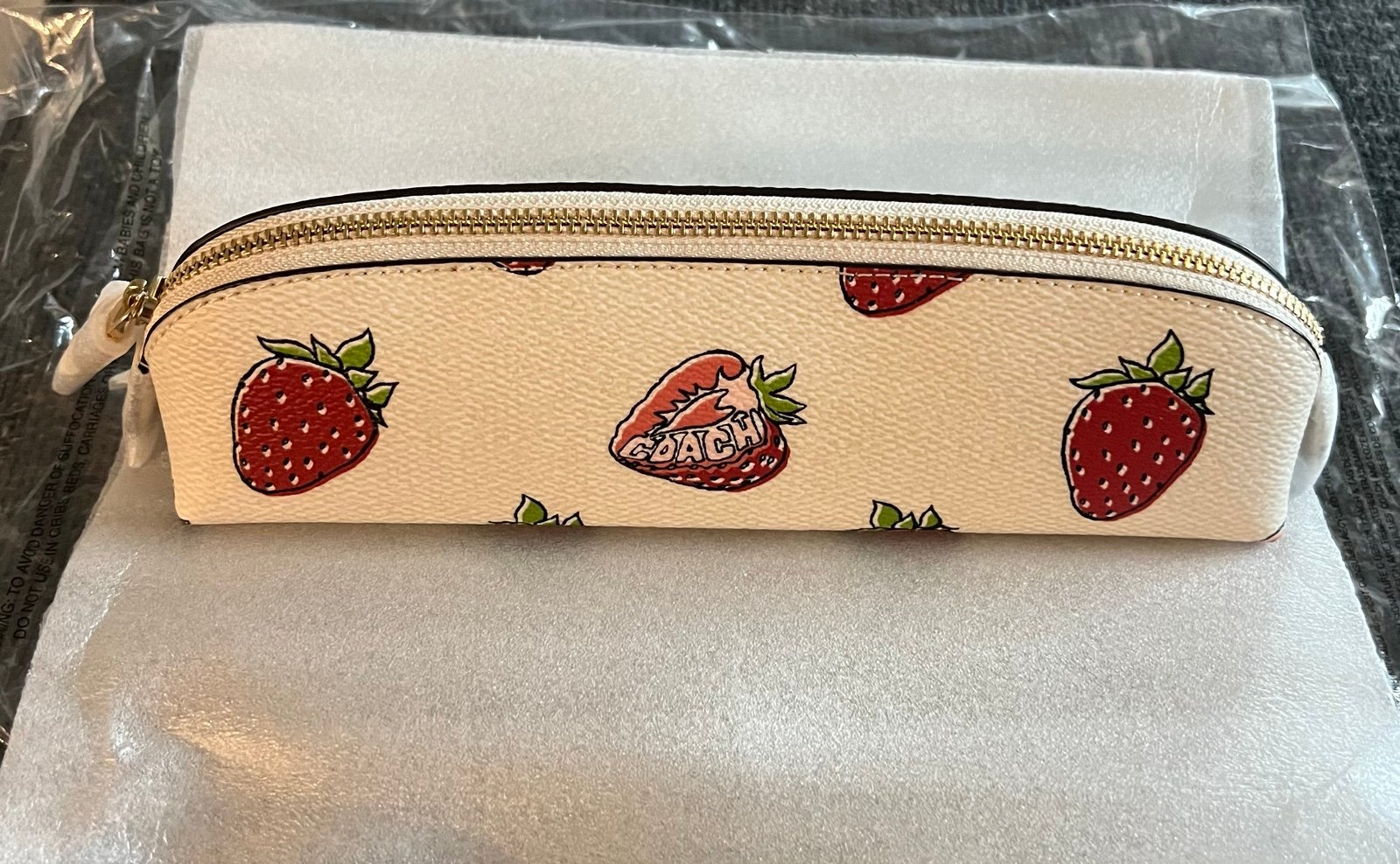 Brand new Coach pencil case with strawberry print