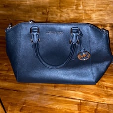 Black Michael Kors purse with handles and long strap