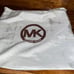 Black Michael Kors purse with handles and long strap