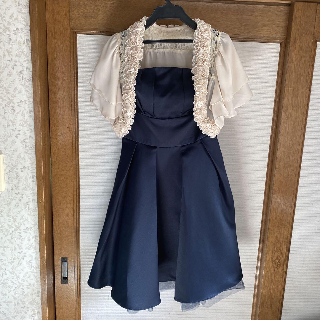 Beige bolero and navy dress for weddings and parties.