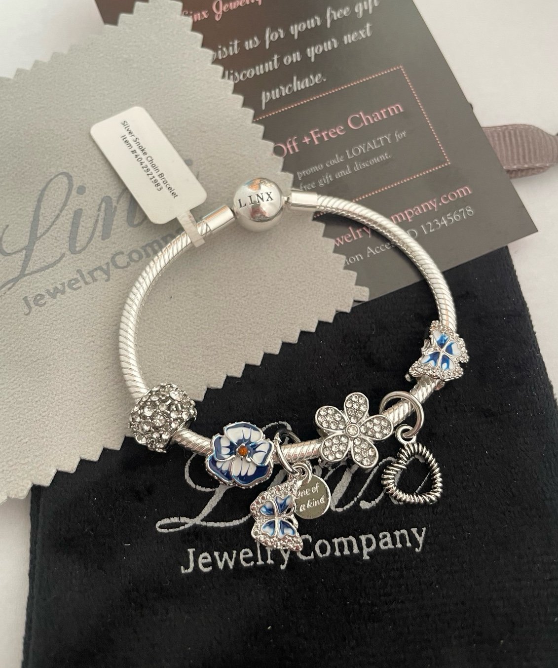 Linx Silver Snake Chain Bracelet with Blue Butterfly and Flower Themed Charms