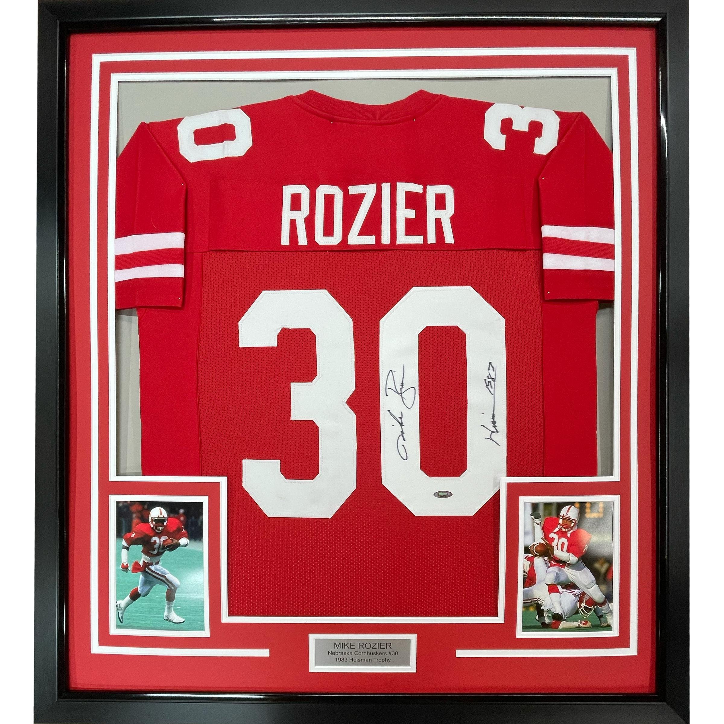 Framed Autographed/Signed Mike Rozier 35x39 Heisman 1983 Nebraska Red Jersey J