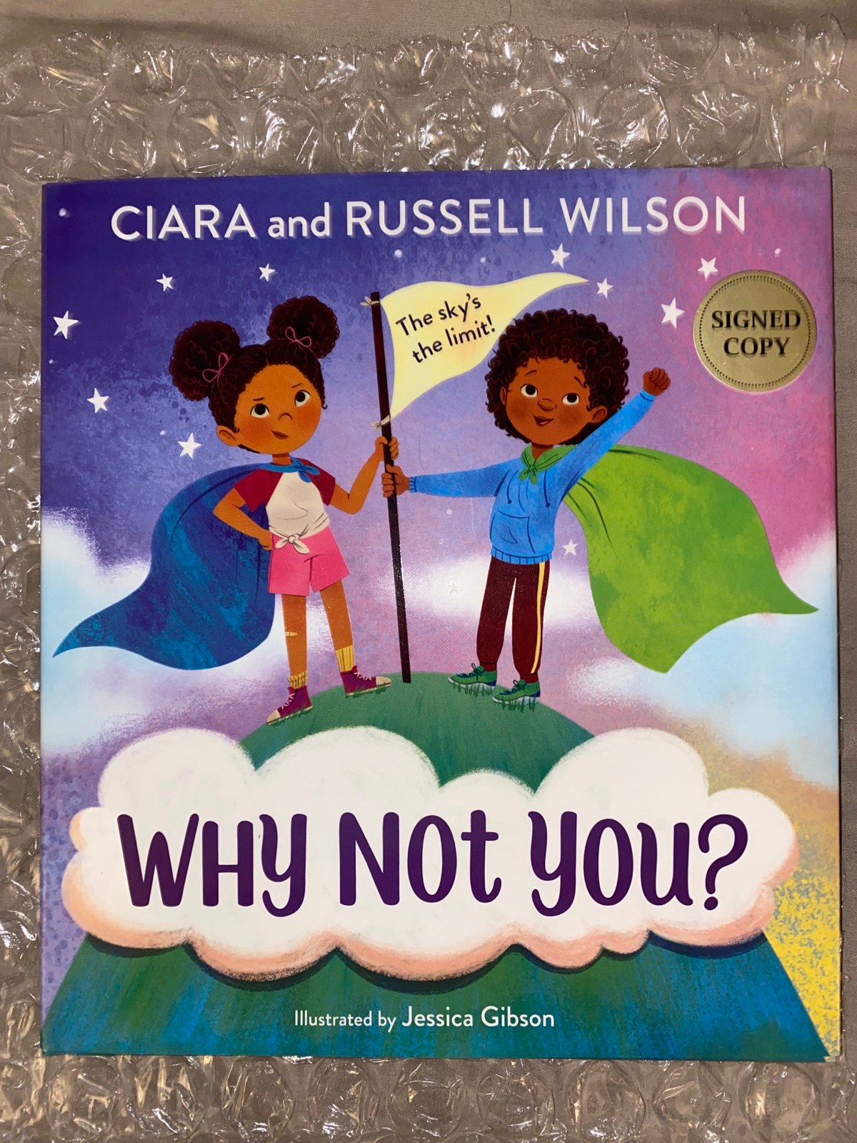 Ciara AND Russel Wilson SIGNED book NFL