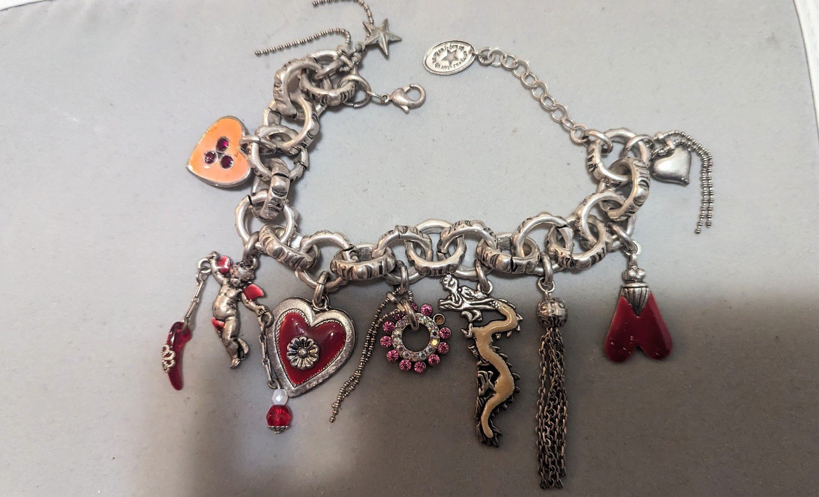 Vintage Les Gens du Sud silver bracelet with many charms, 8 length