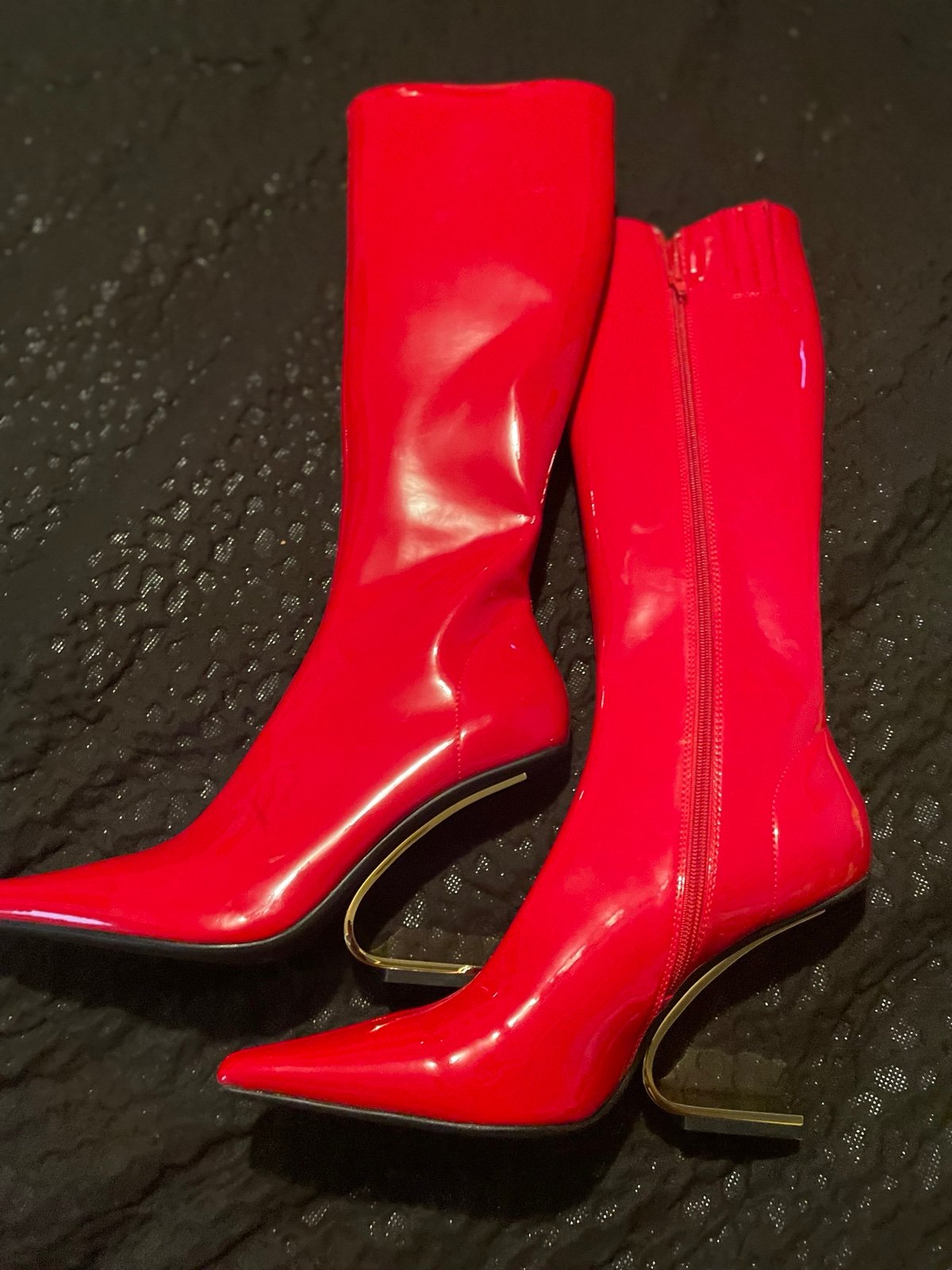 Tall red patent leather boots